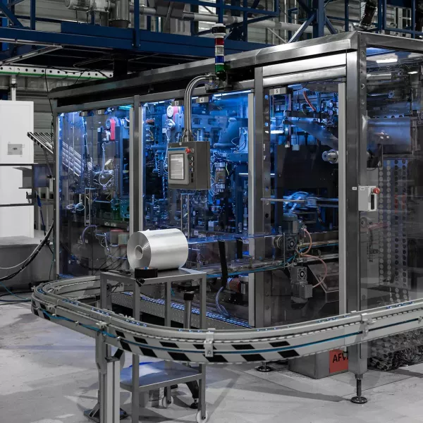 Industrial coffee capsule filling line compatible with AluSense aluminium capsules, ensuring smooth and efficient production.