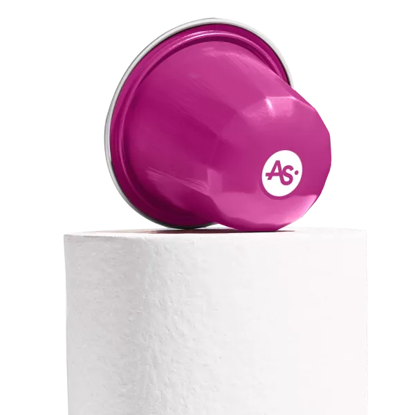 Rose pink AluSense aluminium coffee capsule with printed logo displayed on a white pedestal against a white background.